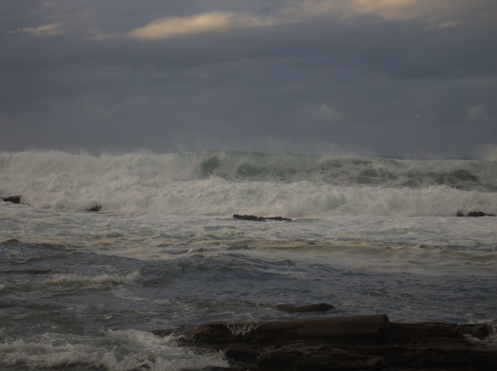 Waves crashing at sunrise